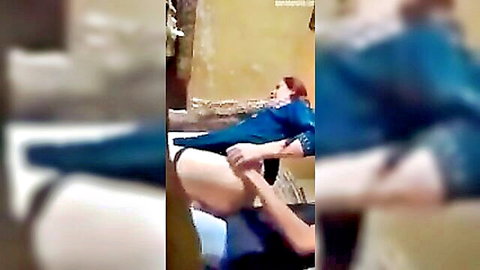 Arab man grips redhead woman's thigh while fucking her exposed pussy missionary style