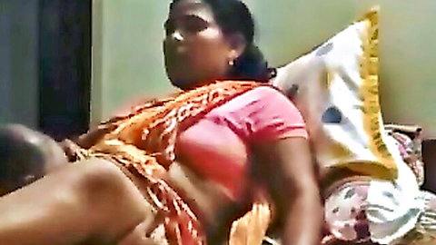 Indian woman in orange saree spreads legs for man's cunnilingus pussy licking