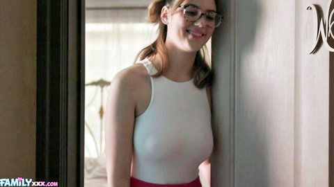 Ellie Nova in tight white top and red skirt, smiling playfully as stepsis