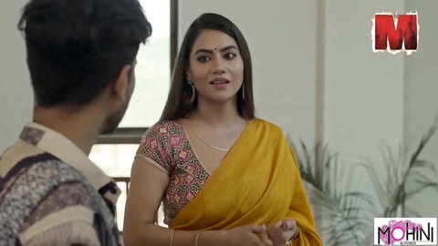 Sexy Indian brunette in yellow saree with cleavage smiling at young guy in kurta ready for desi fuck