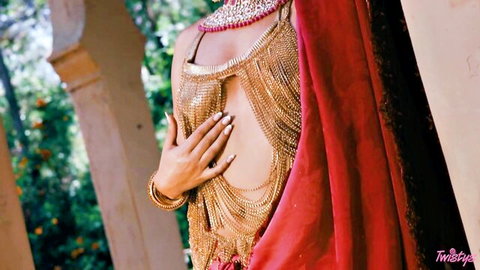 Curvy Indian babe in revealing gold chainmail top teases curves outdoors with jewelry