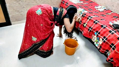 Indian woman in red saree bends over showing big juicy ass