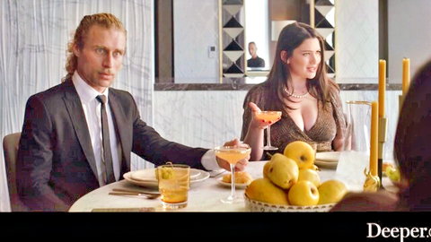 Suited blonde hunk eyes brunette bombshell's huge tits cleavage at candlelit dinner table