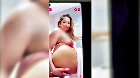 Curvy Indian babe with big ass and tits teases in mirror selfie stripping pink lingerie