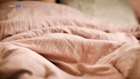 Rissa May on pink bedsheets in I Dream of Daddy scene