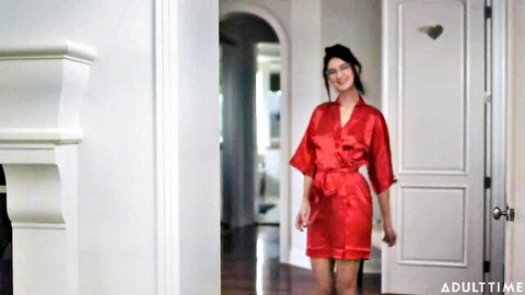 Eliza Ibarra in sexy red silk robe, teasing smile in doorway