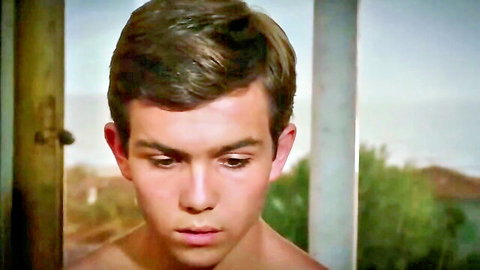 Young shirtless man in Laura Antonelli mom beauty scene