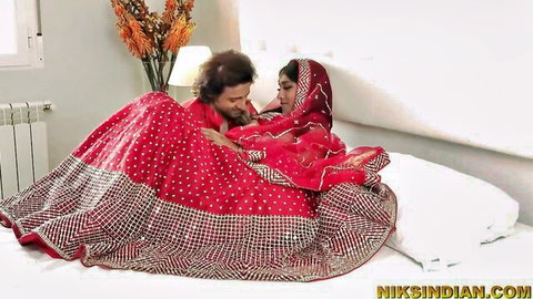 Yasmina Khan as Arab virgin wife in red bridal lehenga intimately embraced