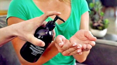 Blonde step sis in green top applies lotion seductively to hands