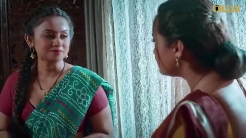 Two hot Indian aunties in sexy sarees, deep cleavage tease